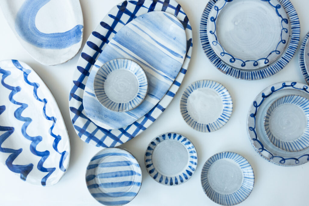 Blue and white hand-painted plates and platters