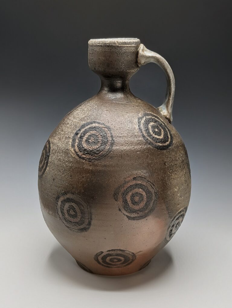 Wood-fired jug with stamped circle pattern